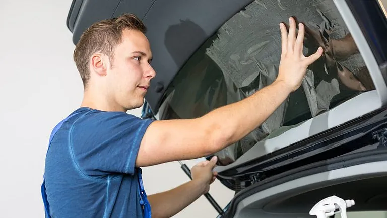 A window being replaced on a car